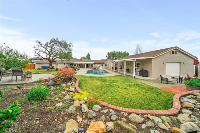 back of house with a patio, fence, and stucco siding