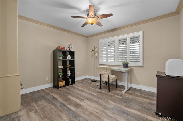 home office with a ceiling fan, wood finished floors, baseboards, and ornamental molding