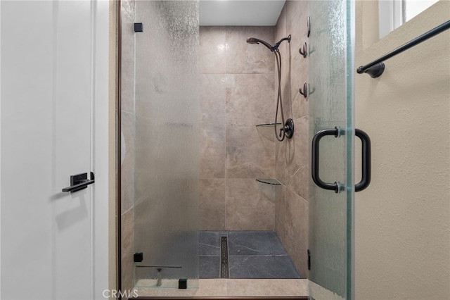 bathroom featuring a stall shower