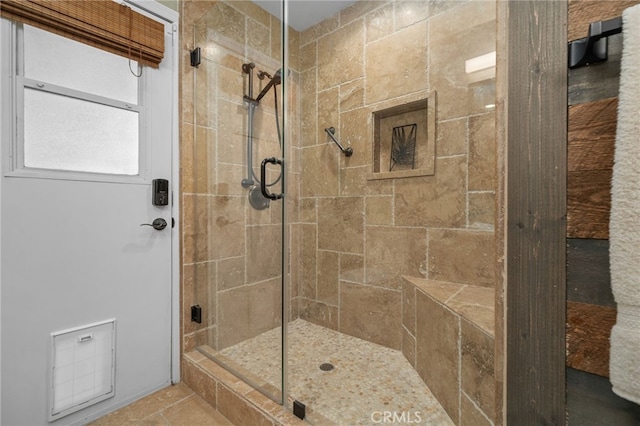 full bathroom with tiled shower