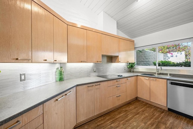 kitchen with light brown cabinets, a sink, vaulted ceiling, stainless steel dishwasher, and black electric cooktop