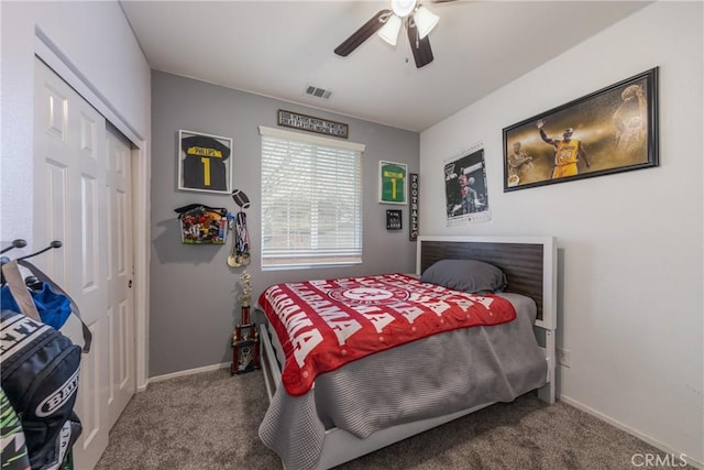 bedroom featuring visible vents, baseboards, a closet, and carpet flooring