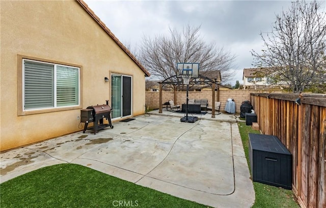 view of patio with a grill and a fenced backyard