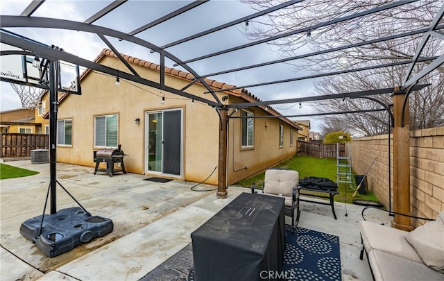 view of patio featuring central AC unit, area for grilling, a fenced backyard, and a pergola