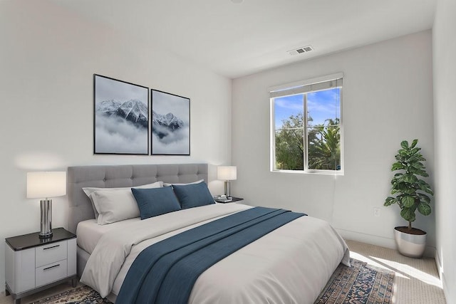 bedroom with visible vents and carpet floors