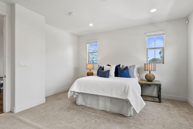 bedroom featuring recessed lighting, carpet, and baseboards