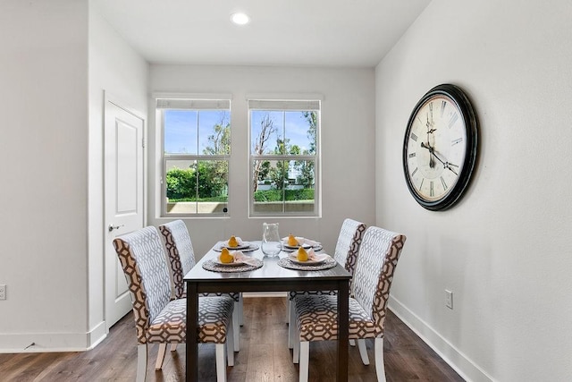 dining room featuring recessed lighting, baseboards, and wood finished floors