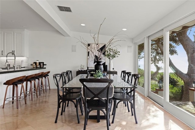 dining room featuring visible vents and recessed lighting