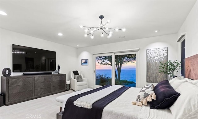 bedroom with carpet floors, recessed lighting, an inviting chandelier, and access to outside