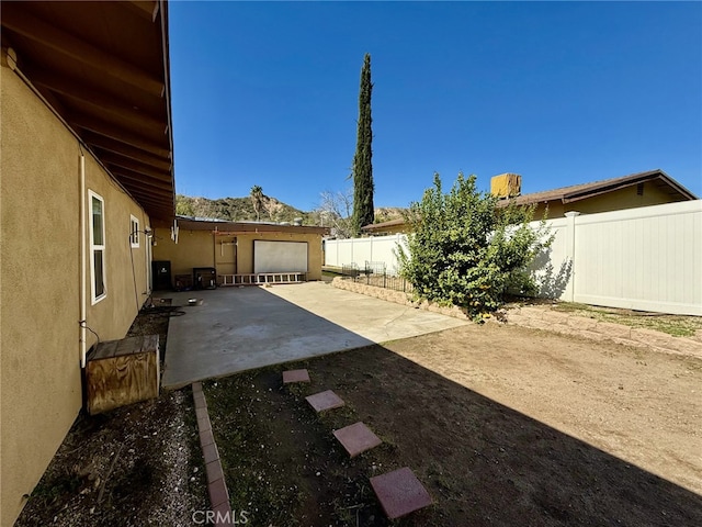 view of yard with a patio area and a fenced backyard