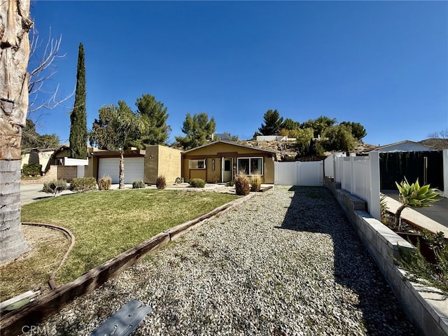 exterior space featuring an attached garage and fence