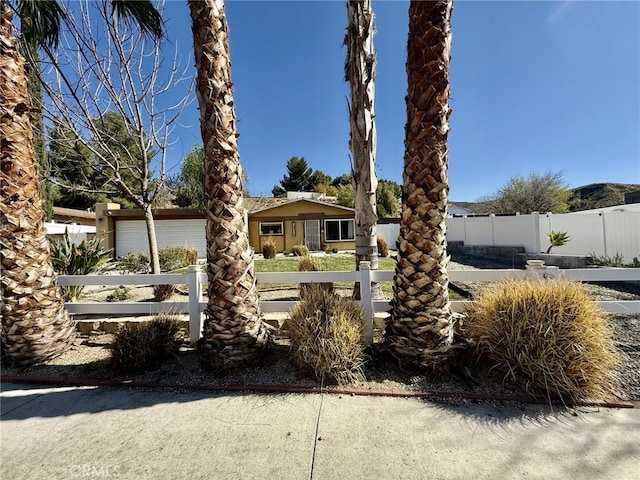 view of front of home with fence