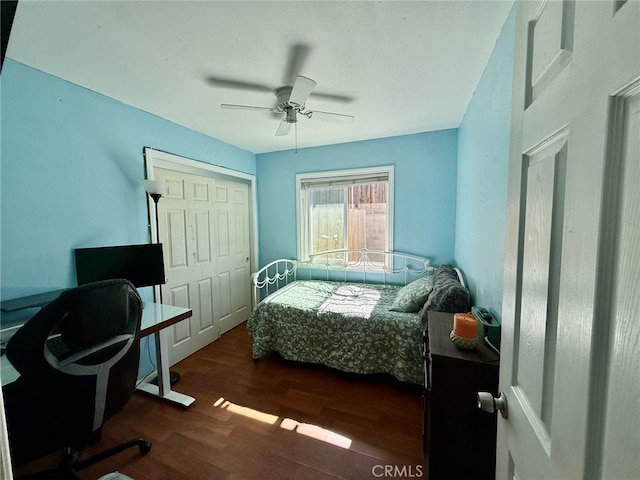 bedroom featuring dark wood finished floors, a closet, and ceiling fan