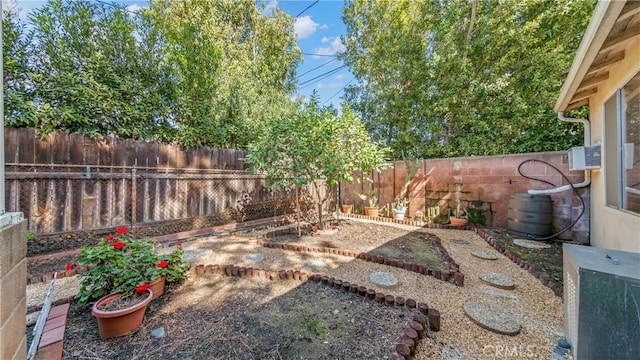 view of yard with a fenced backyard