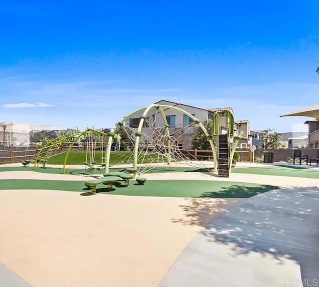 communal playground featuring fence