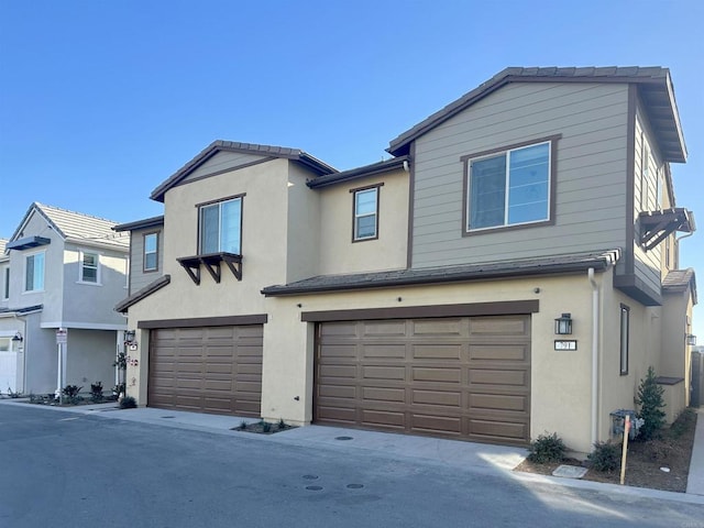 view of front of home featuring stucco siding and an attached garage