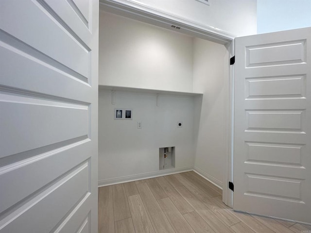 washroom featuring washer hookup, light wood-style floors, baseboards, hookup for an electric dryer, and laundry area