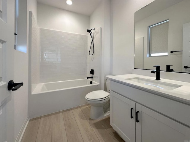 bathroom featuring vanity,  shower combination, toilet, and wood tiled floor