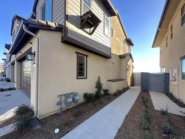 791 Cornelia Way, Rancho Mission Viejo, CA 92694 - view of property exterior with a gate, a garage, and stucco siding