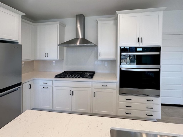 791 Cornelia Way, Rancho Mission Viejo, CA 92694 - kitchen featuring freestanding refrigerator, wall chimney exhaust hood, gas stovetop, double oven, and white cabinets