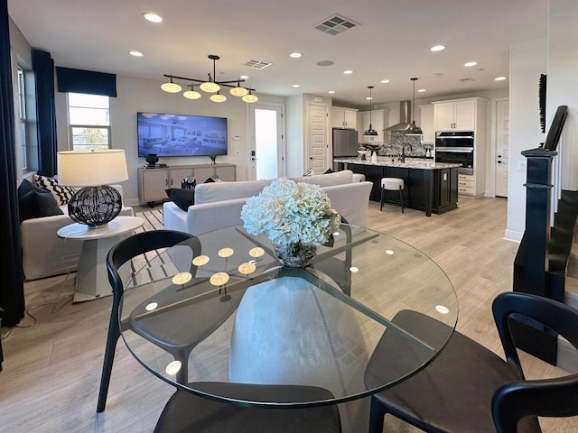791 Cornelia Way, Rancho Mission Viejo, CA 92694 - dining space featuring light wood-style floors, recessed lighting, baseboards, and a chandelier