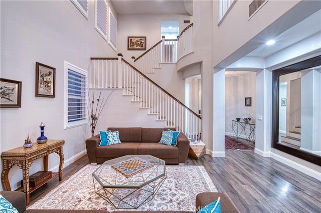 16 Lyra Way, Coto De Caza, CA 92679 - living room featuring stairway, wood finished floors, baseboards, and a high ceiling