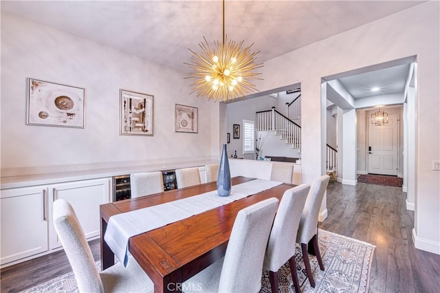 16 Lyra Way, Coto De Caza, CA 92679 - dining room featuring a chandelier, stairs, dark wood-style floors, and baseboards