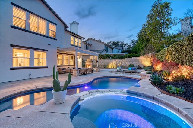 16 Lyra Way, Coto De Caza, CA 92679 - pool at dusk with a pergola, fence, outdoor lounge area, a patio, and a pool with connected hot tub