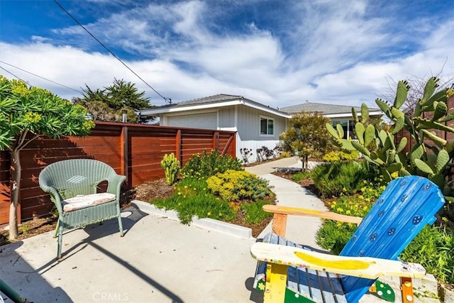 view of patio / terrace featuring fence