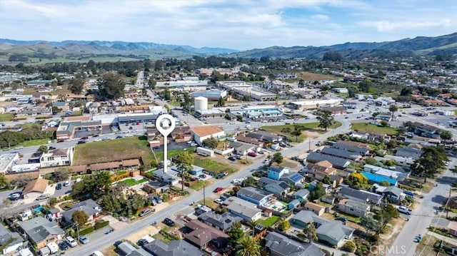 birds eye view of property with a mountain view