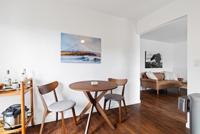 dining area with wood finished floors