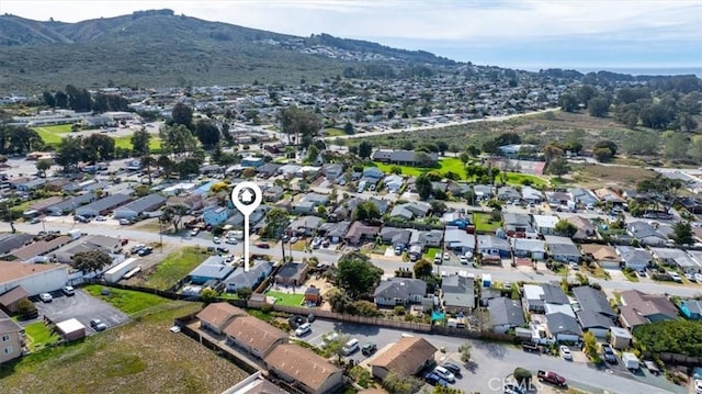 birds eye view of property with a mountain view and a residential view