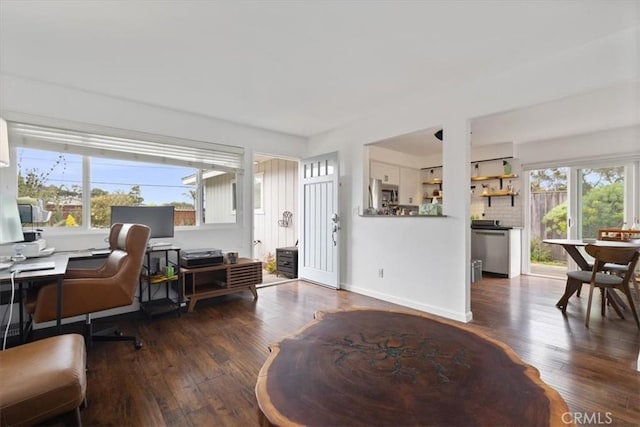 office space with a wealth of natural light, baseboards, and wood finished floors