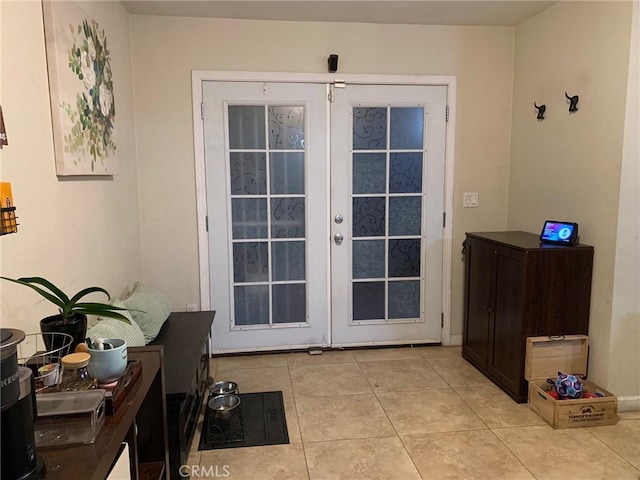 entryway featuring french doors and light tile patterned flooring