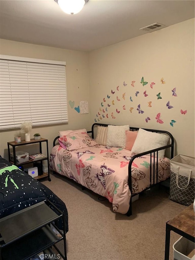 bedroom with carpet flooring and visible vents