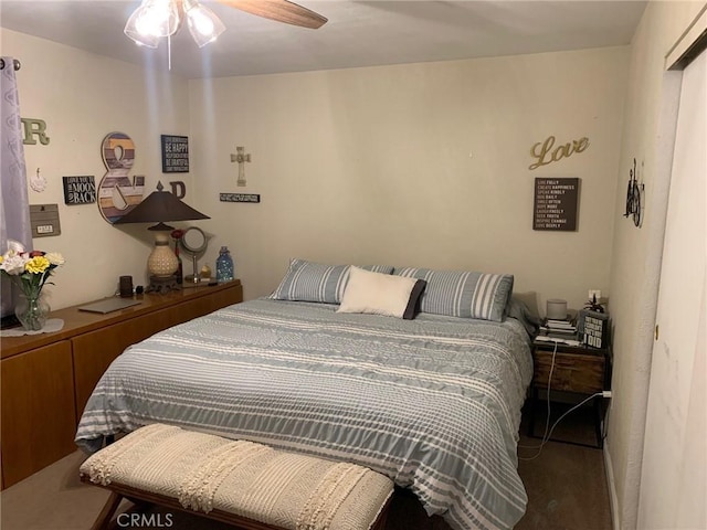 carpeted bedroom with a ceiling fan