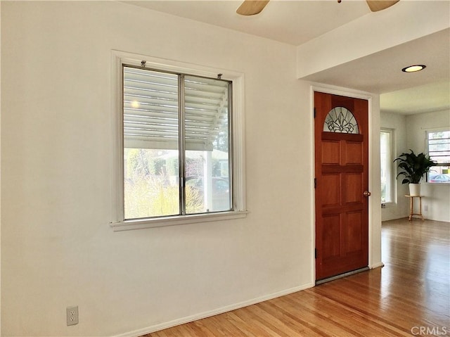 entryway featuring recessed lighting, wood finished floors, baseboards, and ceiling fan