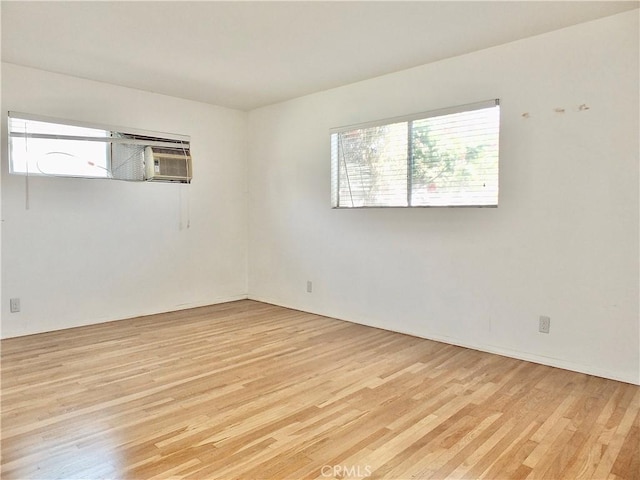 spare room featuring light wood-type flooring