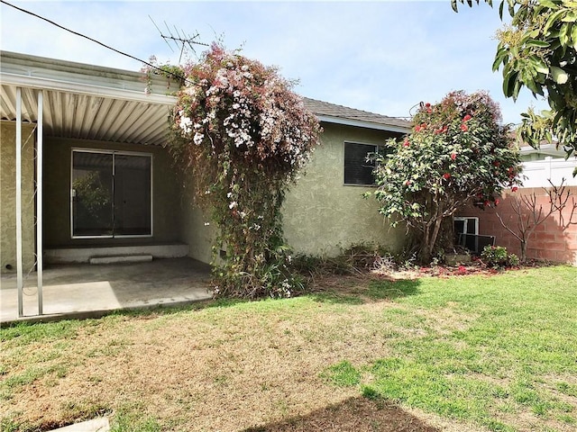 view of yard featuring a patio and fence