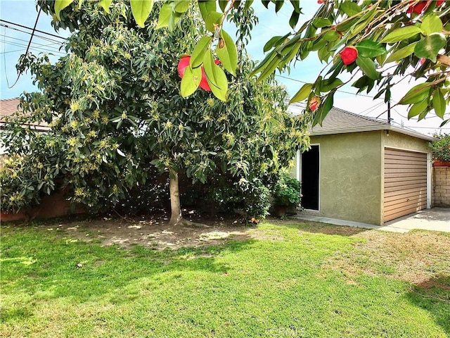 view of yard featuring a garage