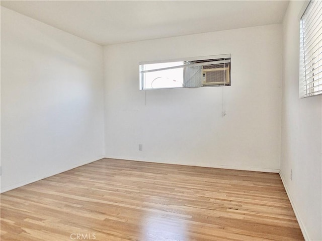 spare room with light wood-style floors