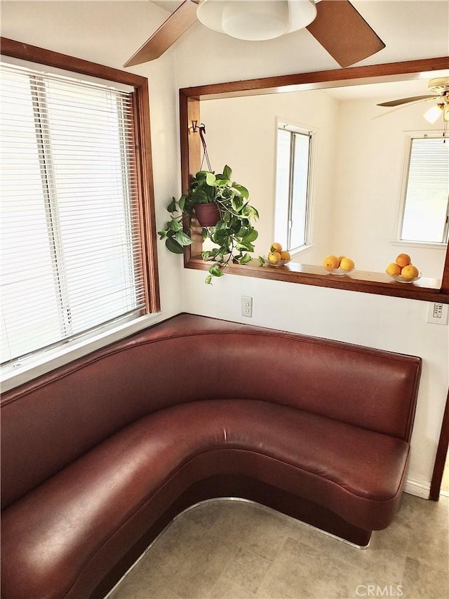 unfurnished room featuring a wealth of natural light and ceiling fan