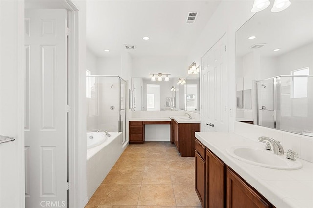 bathroom with a sink, visible vents, a bath, and a shower stall