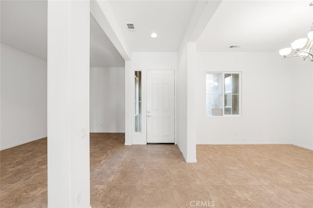 spare room featuring recessed lighting, baseboards, visible vents, and a chandelier