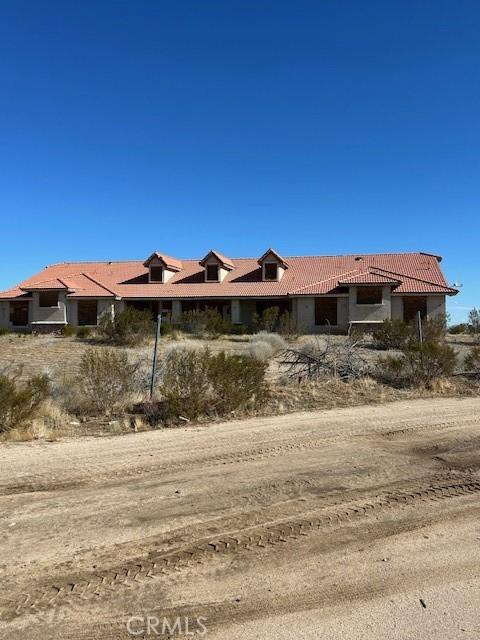 view of front of home with a tiled roof