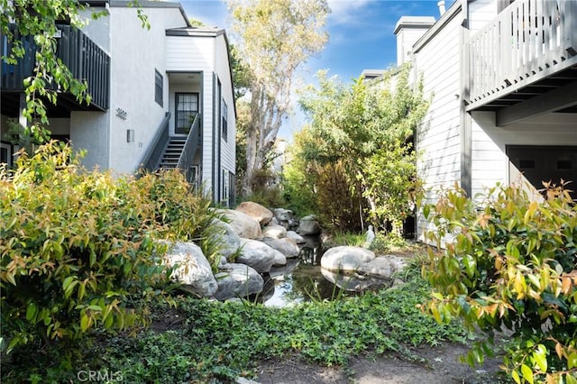 view of yard featuring stairway