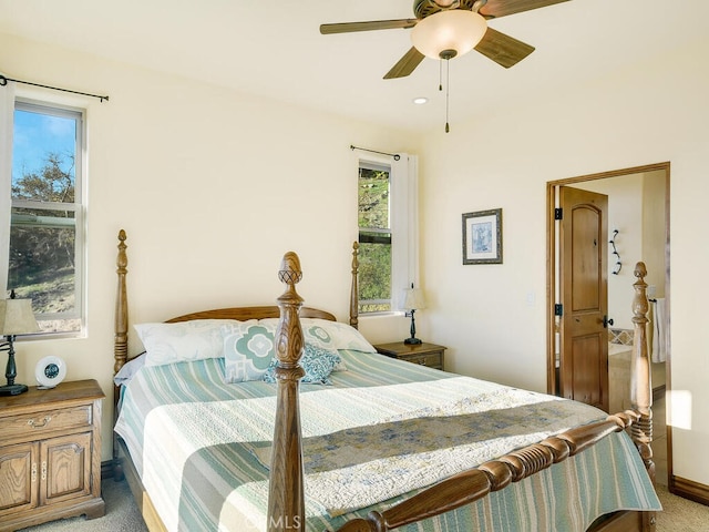 bedroom featuring a ceiling fan and light colored carpet