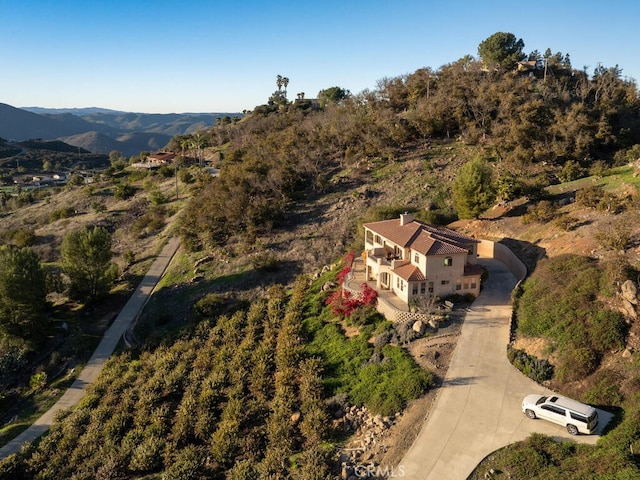 drone / aerial view featuring a mountain view