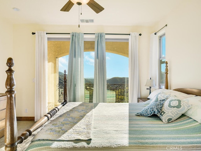 bedroom with access to exterior, visible vents, ceiling fan, baseboards, and carpet floors