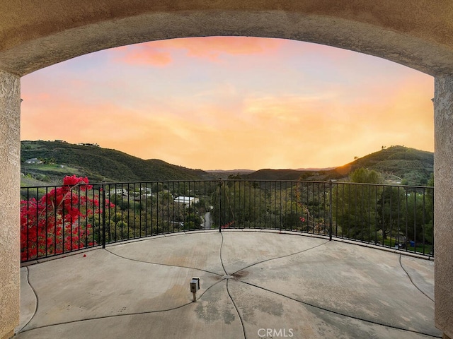 view of patio / terrace featuring a mountain view